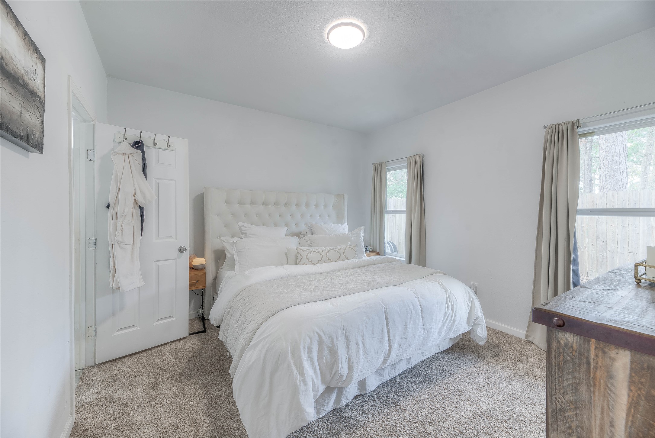 627 Pinewood Drive Trinity, TX 75862 - Photo 10 of 36 a bedroom with a bed and a window