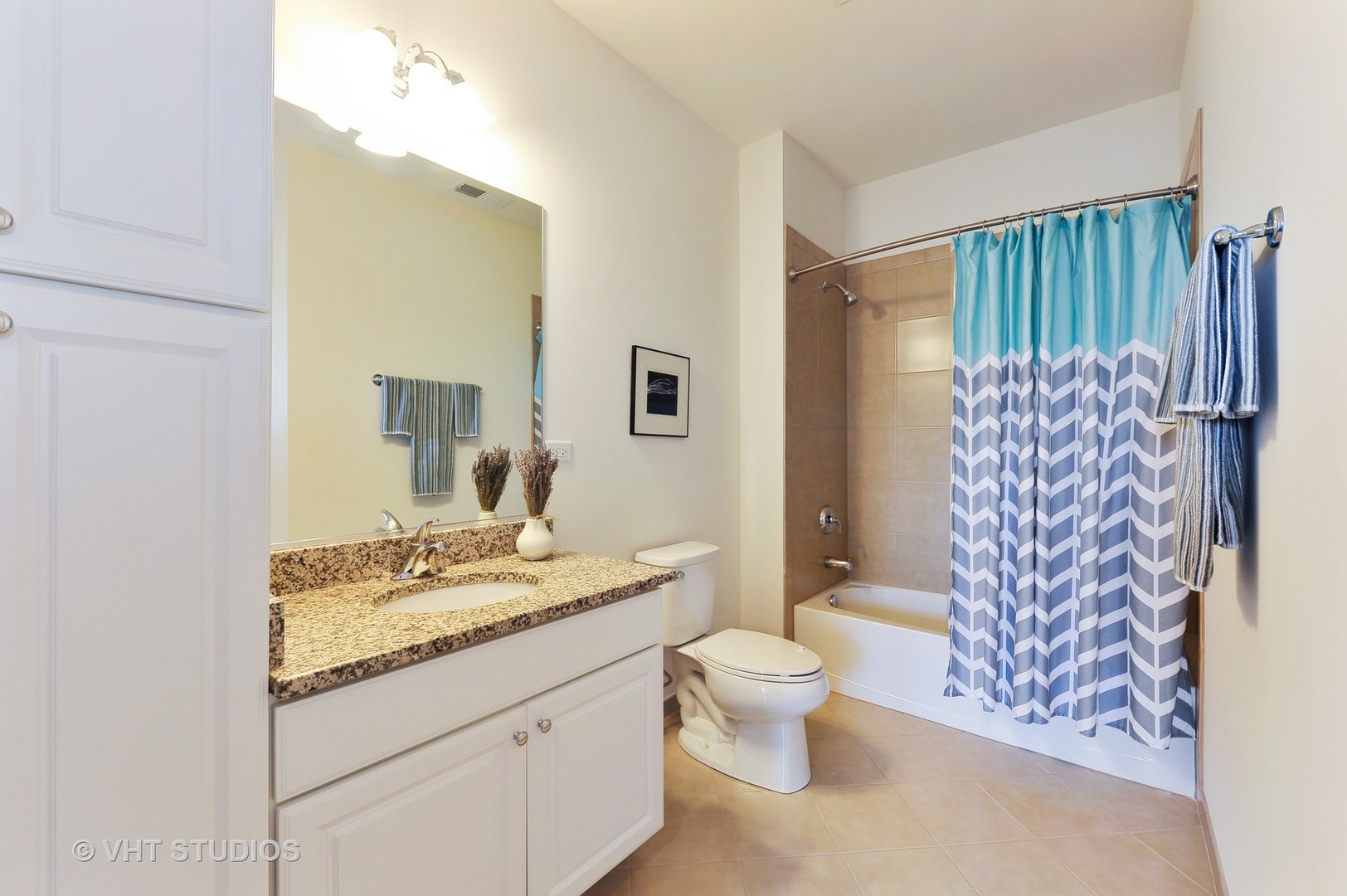 2701 Commons Drive, Unit 207 Glenview, IL 60026 - Photo 15 of 23 a bathroom with a granite countertop sink toilet and shower