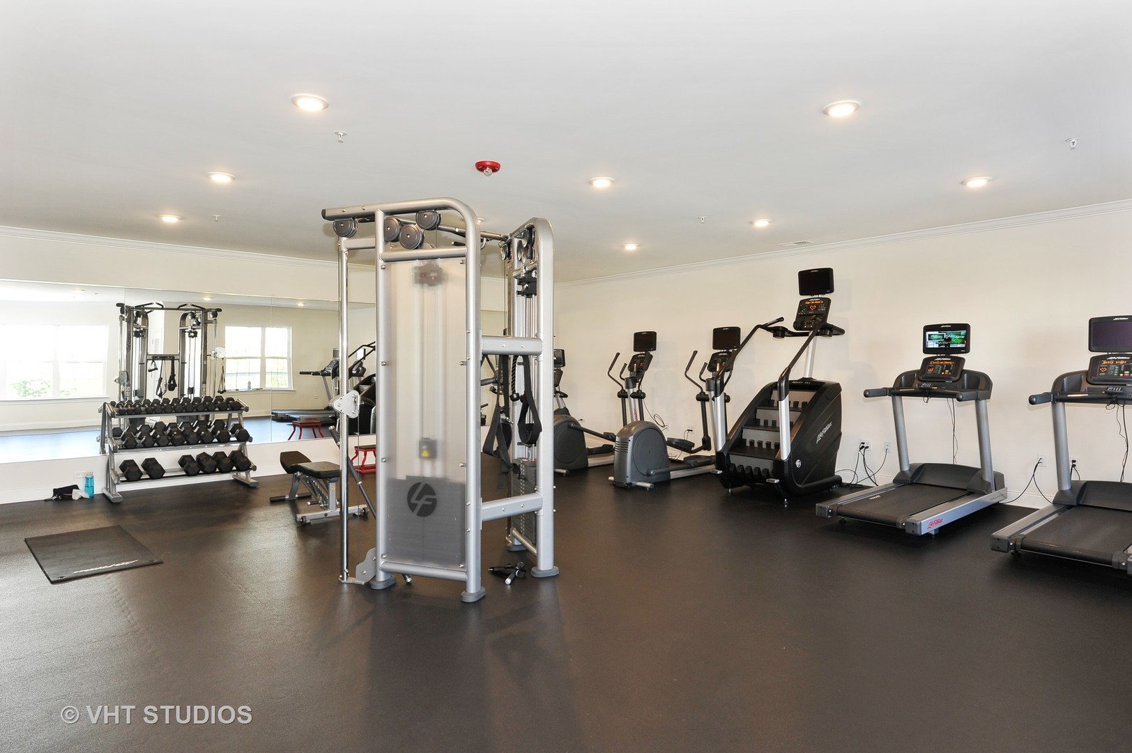 2701 Commons Drive, Unit 207 Glenview, IL 60026 - Photo 17 of 23 a view of a room with gym equipment
