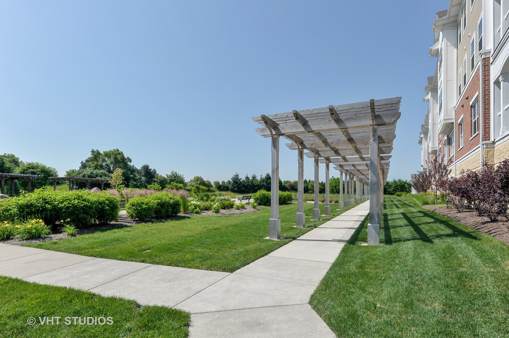 2701 Commons Drive, Unit 207 Glenview, IL 60026 - Photo 20 of 23 a view of a house with a yard