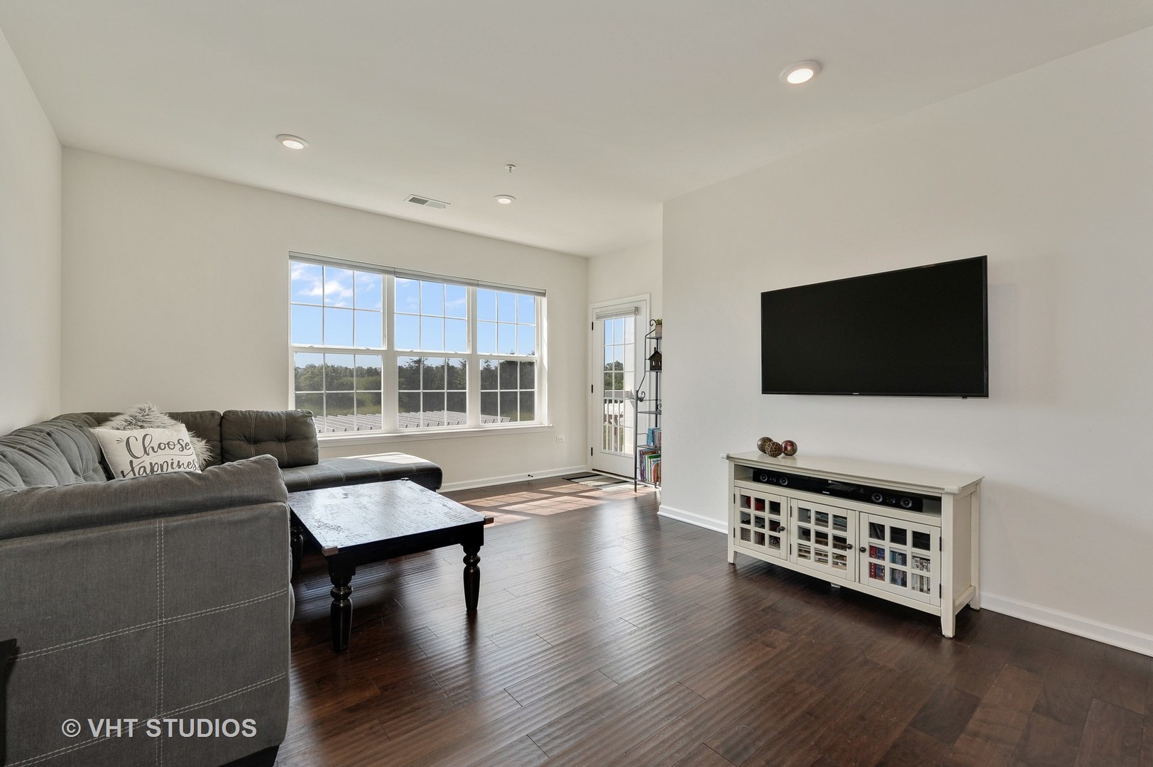 2701 Commons Drive, Unit 207 Glenview, IL 60026 - Photo 3 of 23 a living room with furniture and a flat screen tv