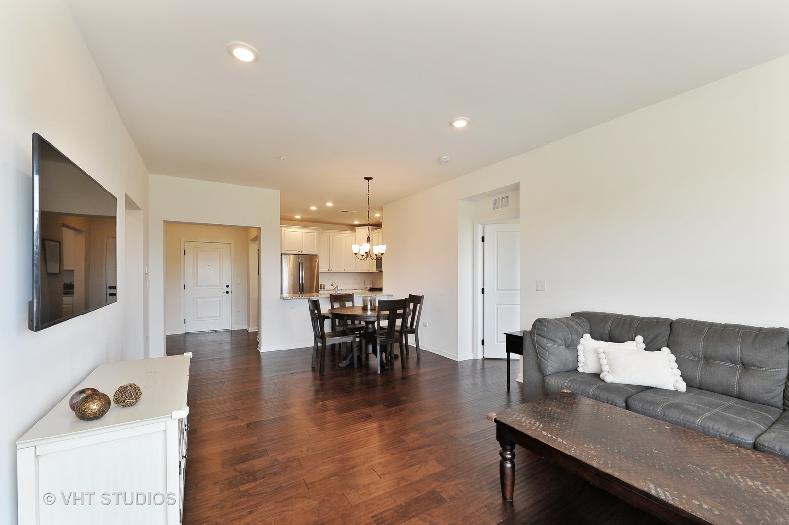 2701 Commons Drive, Unit 207 Glenview, IL 60026 - Photo 5 of 23 a living room with furniture and wooden floor