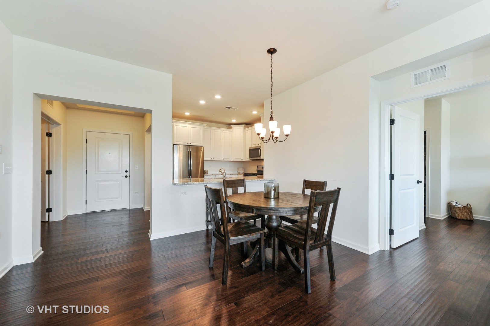 2701 Commons Drive, Unit 207 Glenview, IL 60026 - Photo 9 of 23 a view of a dining room with furniture and wooden floor