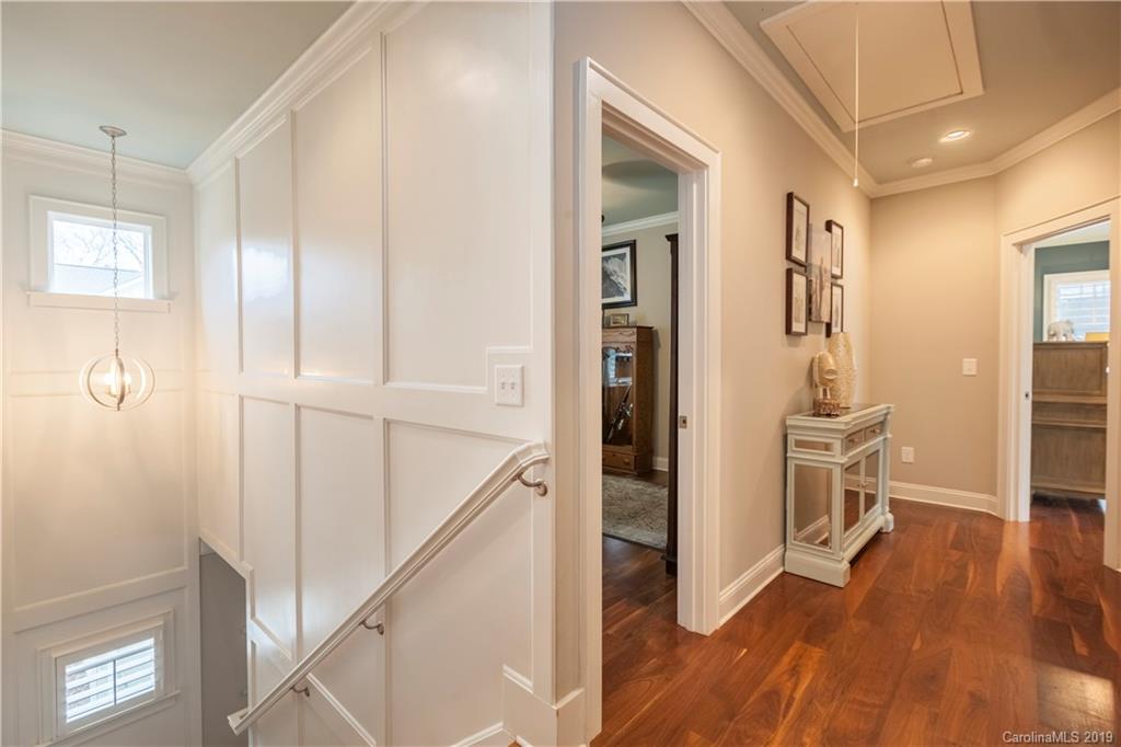 1911 Truman Road Charlotte, NC 28205 - Photo 14 of 30 a view of a hallway with wooden floor and dining room