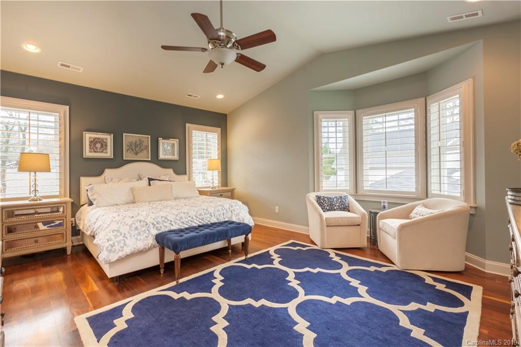 1911 Truman Road Charlotte, NC 28205 - Photo 15 of 30 a bedroom with a bed and wooden floor