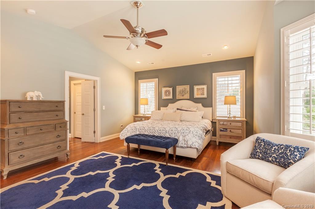 1911 Truman Road Charlotte, NC 28205 - Photo 16 of 30 a spacious bedroom with a bed a couch and two dresser