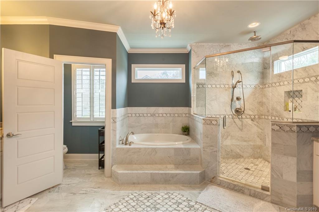 1911 Truman Road Charlotte, NC 28205 - Photo 19 of 30 a en suite bathroom with a shower
