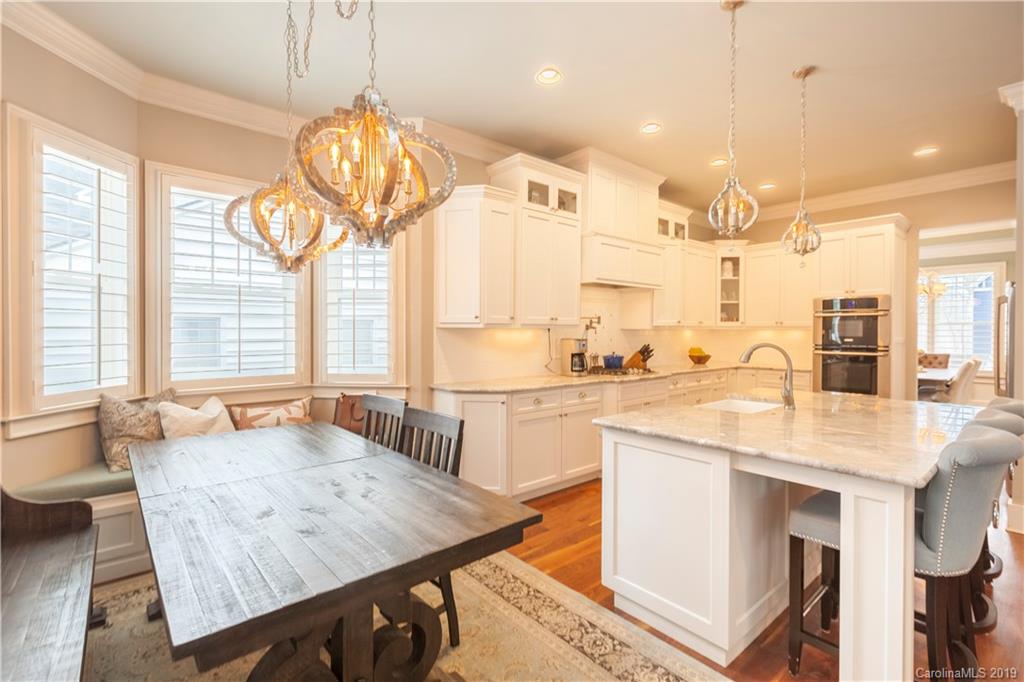 1911 Truman Road Charlotte, NC 28205 - Photo 3 of 30 a large kitchen with kitchen island a large island in it