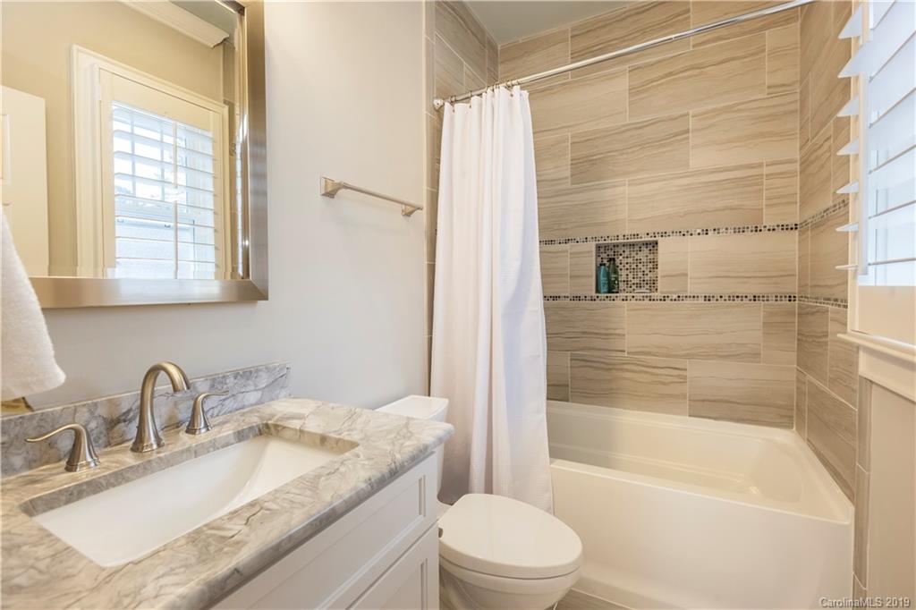 1911 Truman Road Charlotte, NC 28205 - Photo 23 of 30 a bathroom with a granite countertop sink toilet and shower