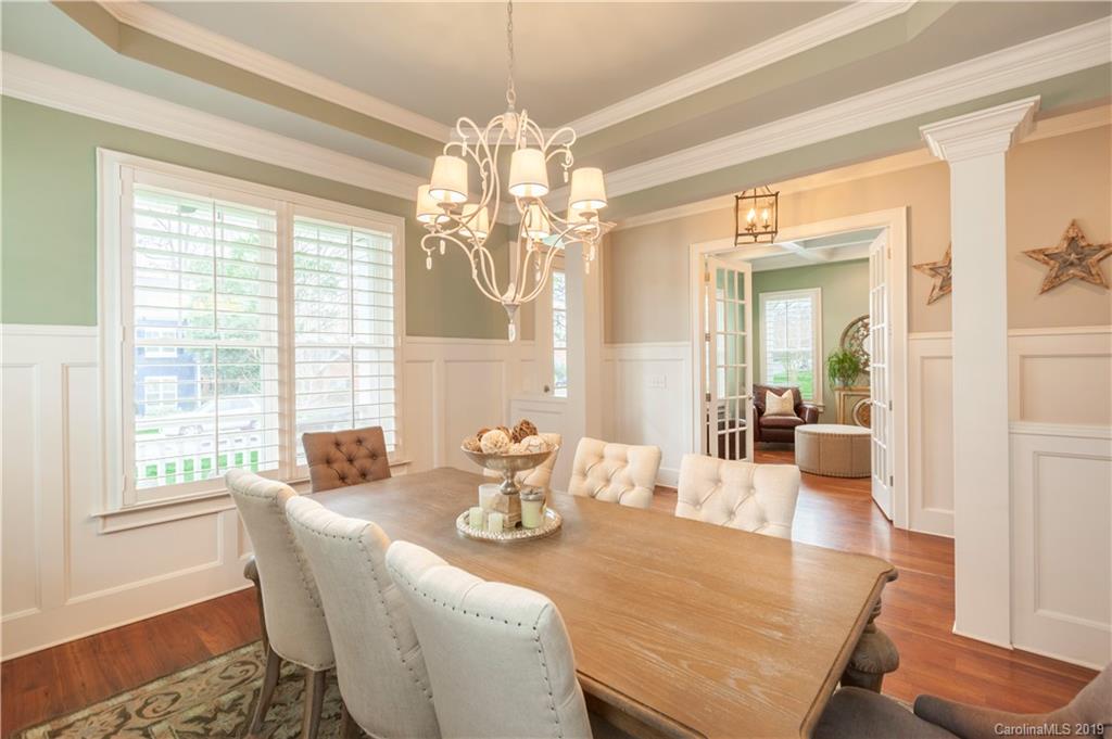 1911 Truman Road Charlotte, NC 28205 - Photo 10 of 30 a view of a dining room with furniture wooden floor and chandelier