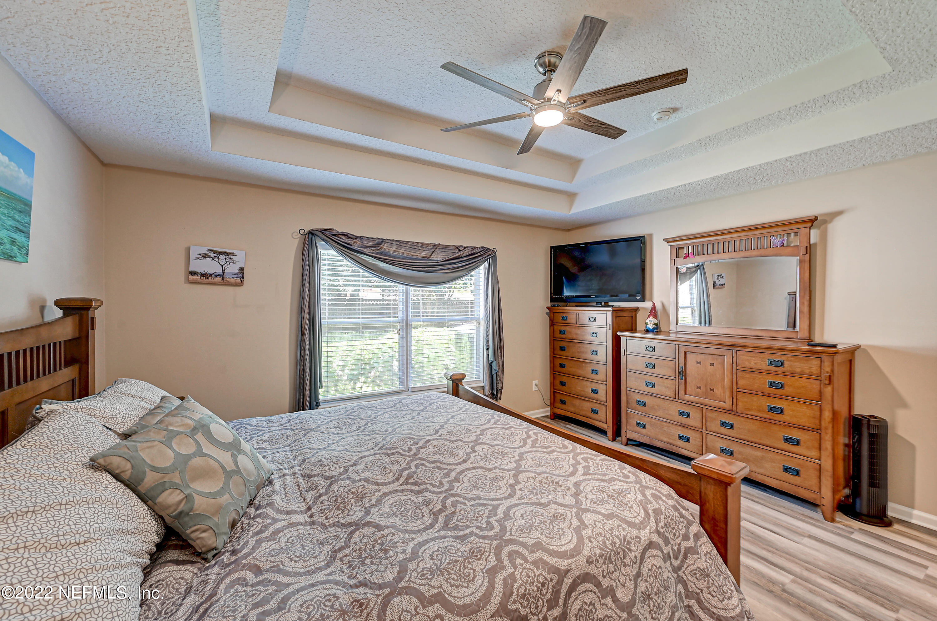 852 Crystal Spring Way St. Augustine, FL 32092 - Photo 15 of 28 a bedroom with a large bed and a dresser