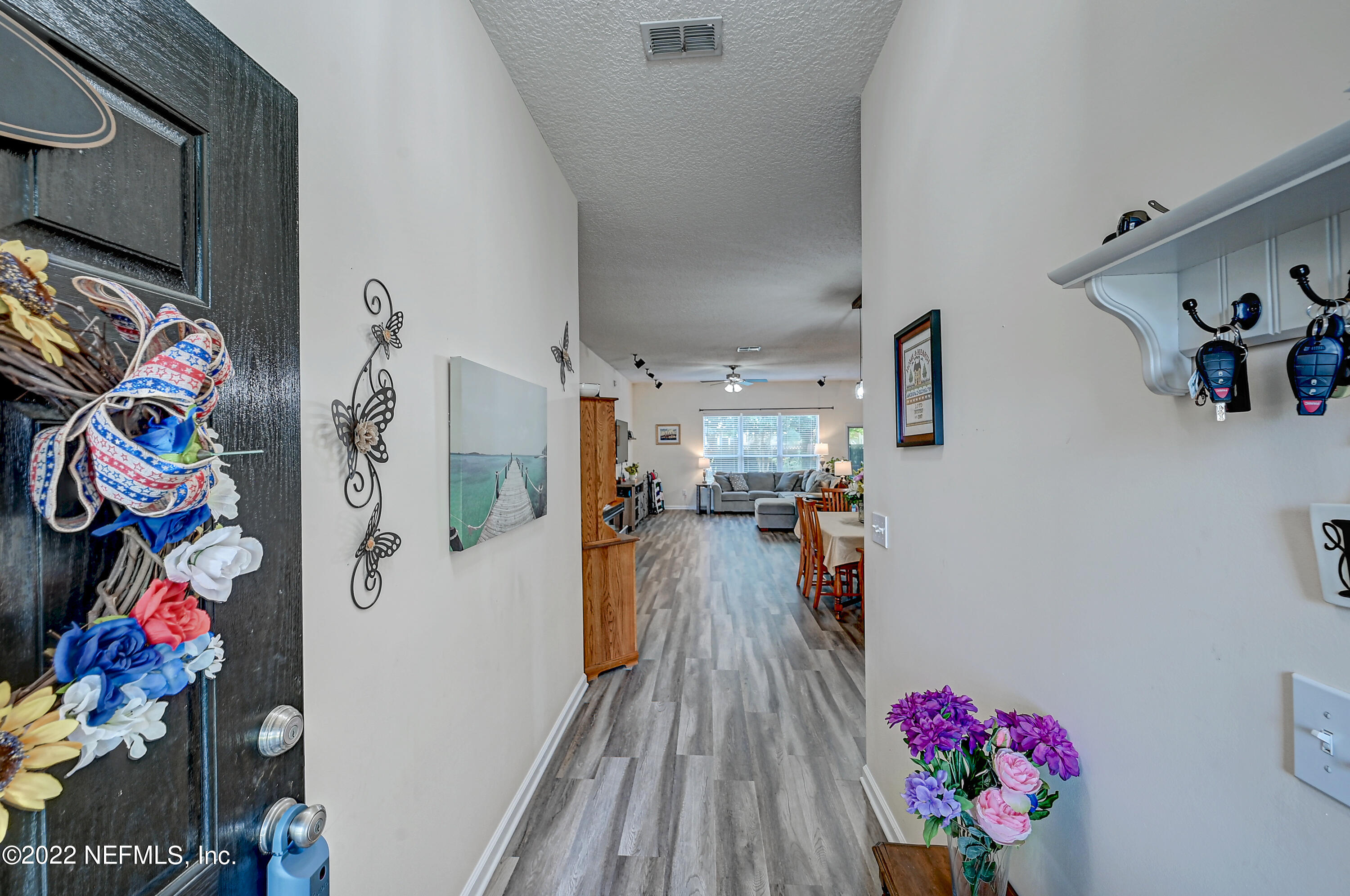 852 Crystal Spring Way St. Augustine, FL 32092 - Photo 4 of 28 a very nice looking room with a lot of stuff