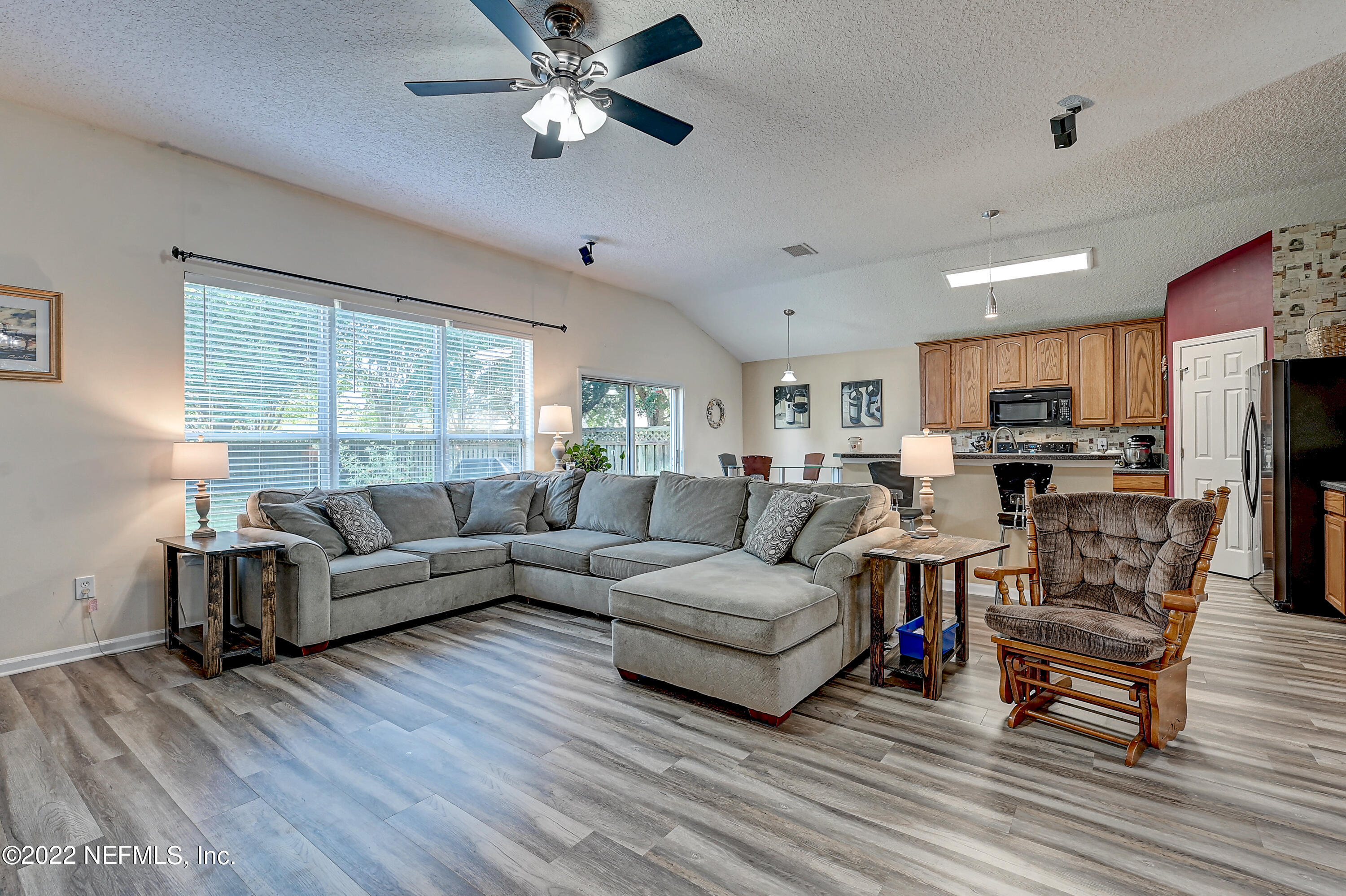 852 Crystal Spring Way St. Augustine, FL 32092 - Photo 7 of 28 a living room with furniture and a large window
