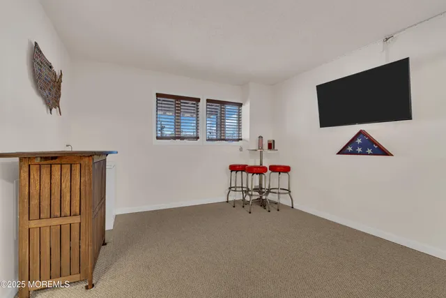 a room with furniture and a flat screen tv