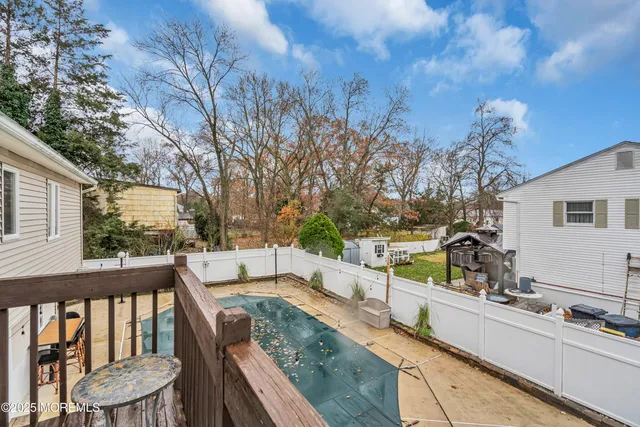 a view of a two chairs and table in the balcony