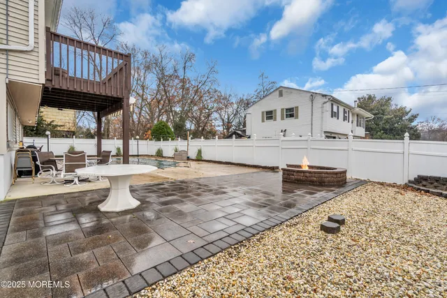 a view of a house with wooden deck