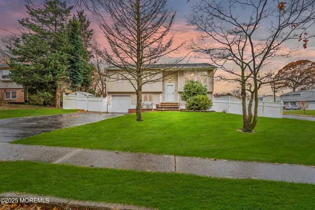 a view of a house with a back yard