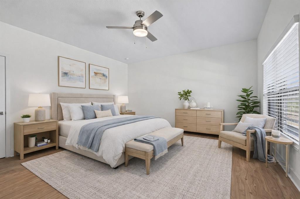 14456 Stellar Place Lakewood Ranch, FL 34202 - Photo 16 of 34 a spacious bedroom with a bed couch table and a couch