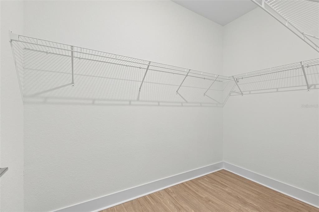 14456 Stellar Place Lakewood Ranch, FL 34202 - Photo 20 of 34 a view of a room with racks on the wall