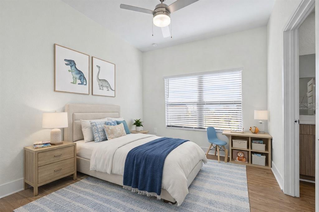 14456 Stellar Place Lakewood Ranch, FL 34202 - Photo 21 of 34 a bed room with a bed and a table