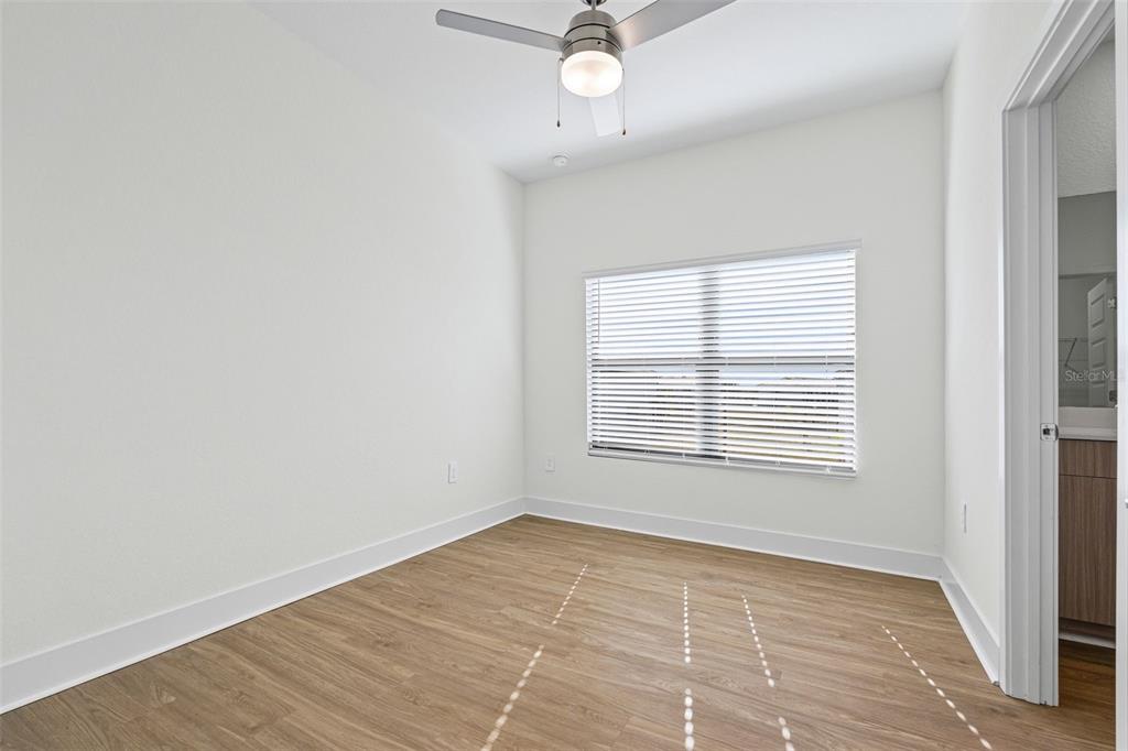 14456 Stellar Place Lakewood Ranch, FL 34202 - Photo 22 of 34 a view of an empty room with a window