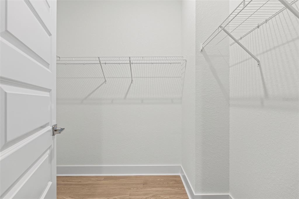 14456 Stellar Place Lakewood Ranch, FL 34202 - Photo 25 of 34 a view of small space with racks on the wall