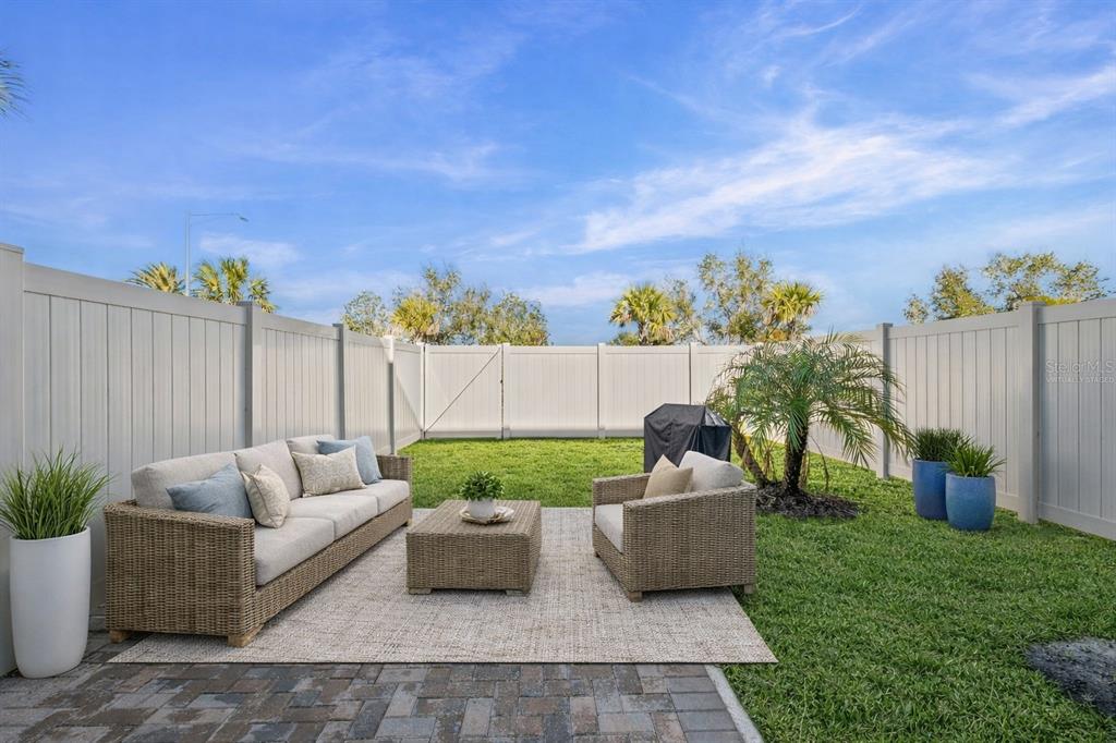 14456 Stellar Place Lakewood Ranch, FL 34202 - Photo 26 of 34 a building outdoor space with patio furniture and garden