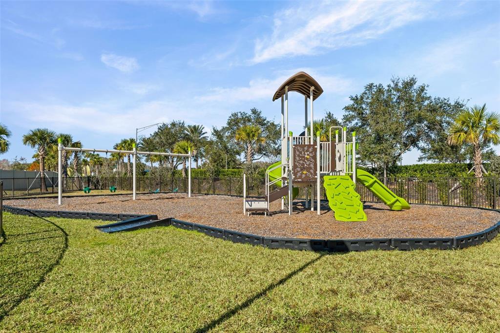 14456 Stellar Place Lakewood Ranch, FL 34202 - Photo 32 of 34 a view of a park with swings and slides