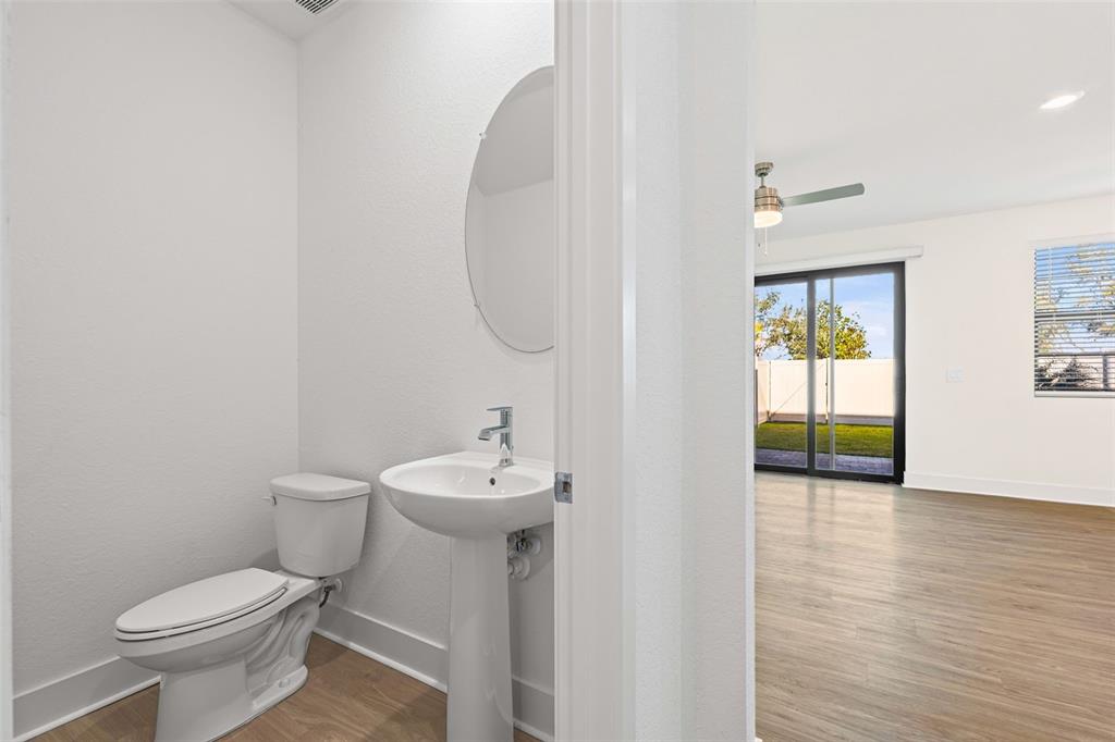 14456 Stellar Place Lakewood Ranch, FL 34202 - Photo 7 of 34 a bathroom with a sink a toilet and a mirror