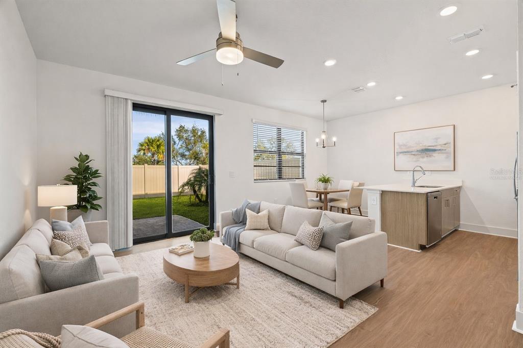 14456 Stellar Place Lakewood Ranch, FL 34202 - Photo 10 of 34 a living room with furniture and a large window
