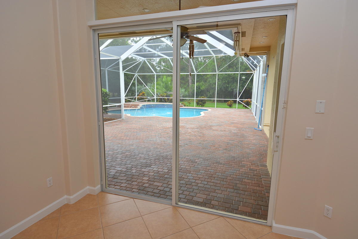 678 Southwest Blue Stem Way Stuart, FL 34997 - Photo 10 of 57 VIEW OF POOL PATIO FROM LIVING ROOM