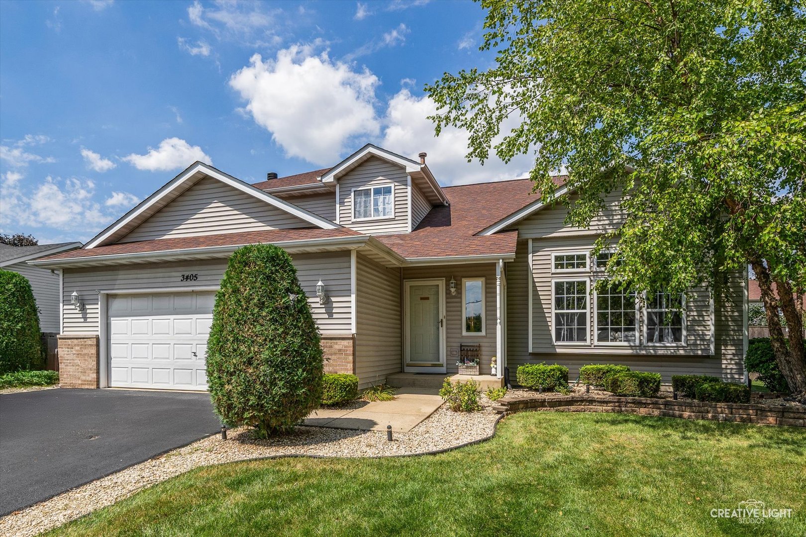 3405 Fiday Road Joliet, IL 60431 - Photo 1 of 26 a front view of a house with a yard and garage