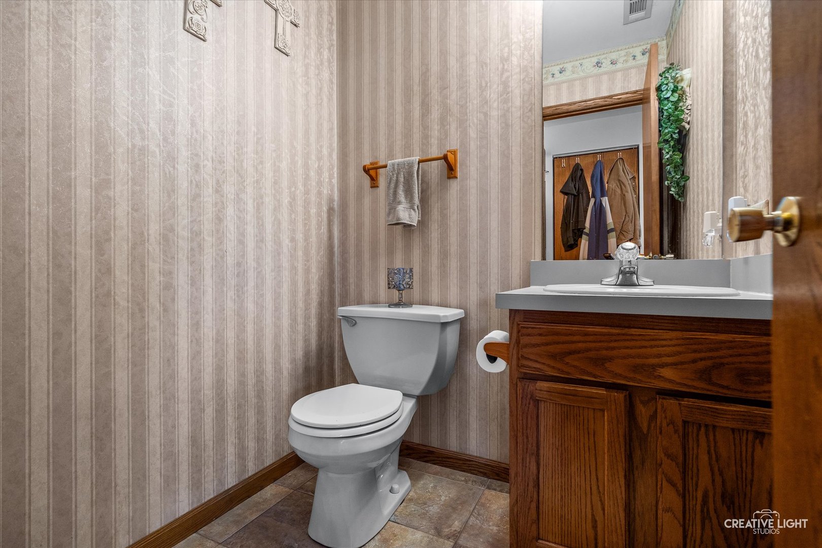 3405 Fiday Road Joliet, IL 60431 - Photo 13 of 26 a bathroom with a toilet a sink and a mirror