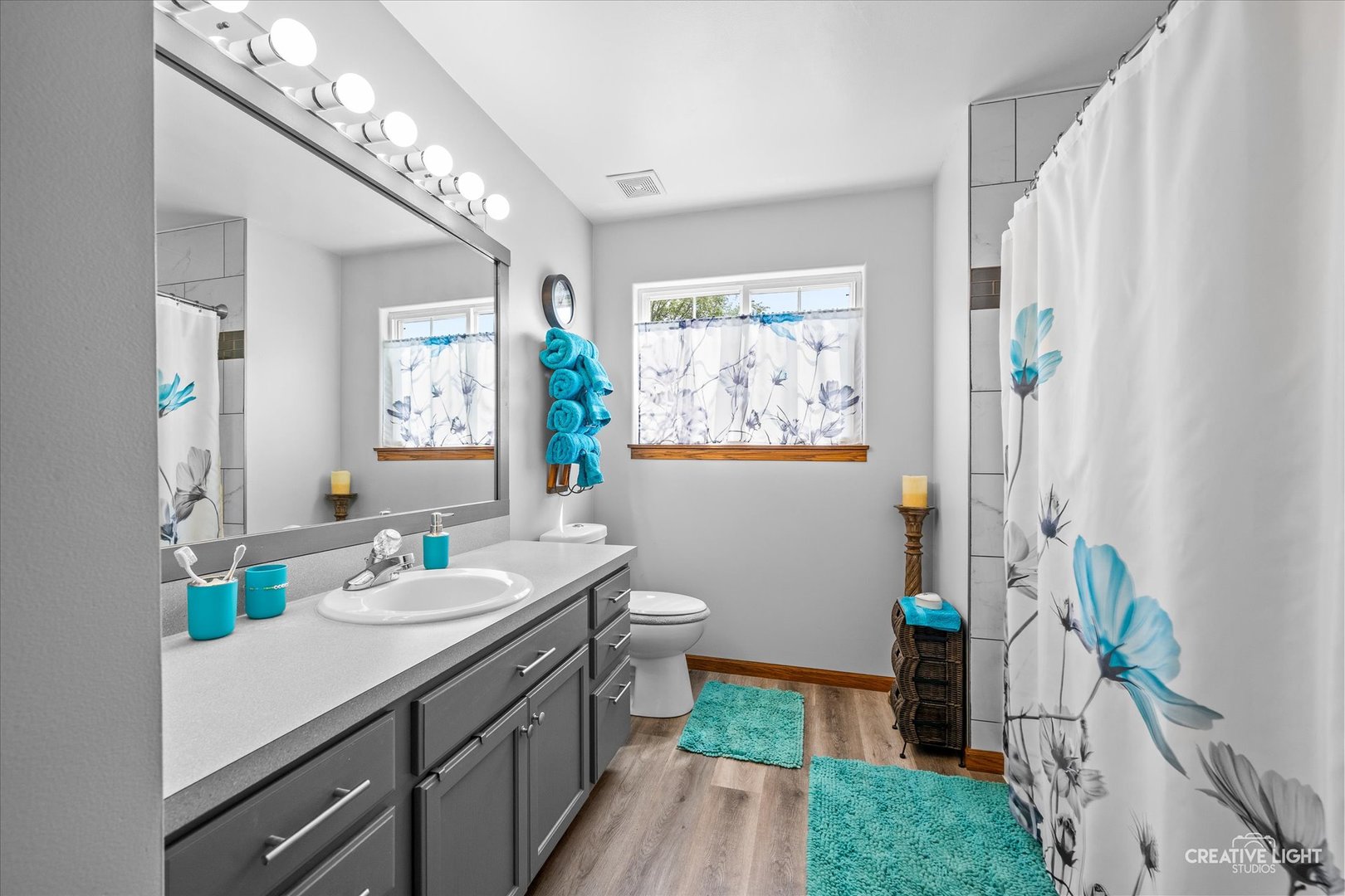 3405 Fiday Road Joliet, IL 60431 - Photo 17 of 26 a bathroom with a sink a toilet and shower curtain