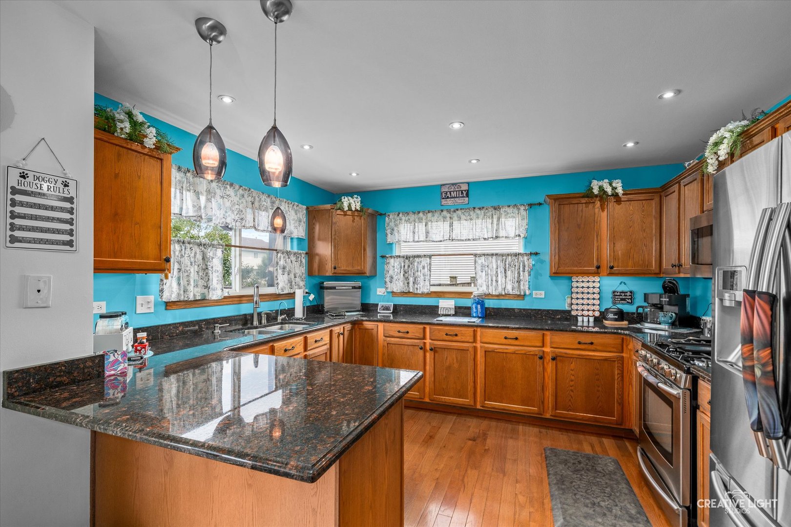 3405 Fiday Road Joliet, IL 60431 - Photo 6 of 26 a kitchen with stainless steel appliances granite countertop a sink a stove and a wooden floor