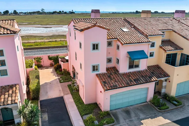 a front view of a house with garden and patio