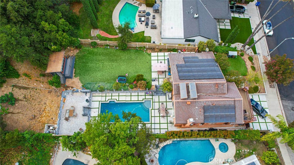 18810 Kirkcolm Lane Porter Ranch, CA 91326 - Photo 37 of 75 an aerial view of a house with a garden and swimming pool