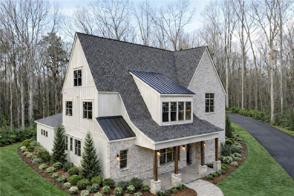 a aerial view of a house with a yard
