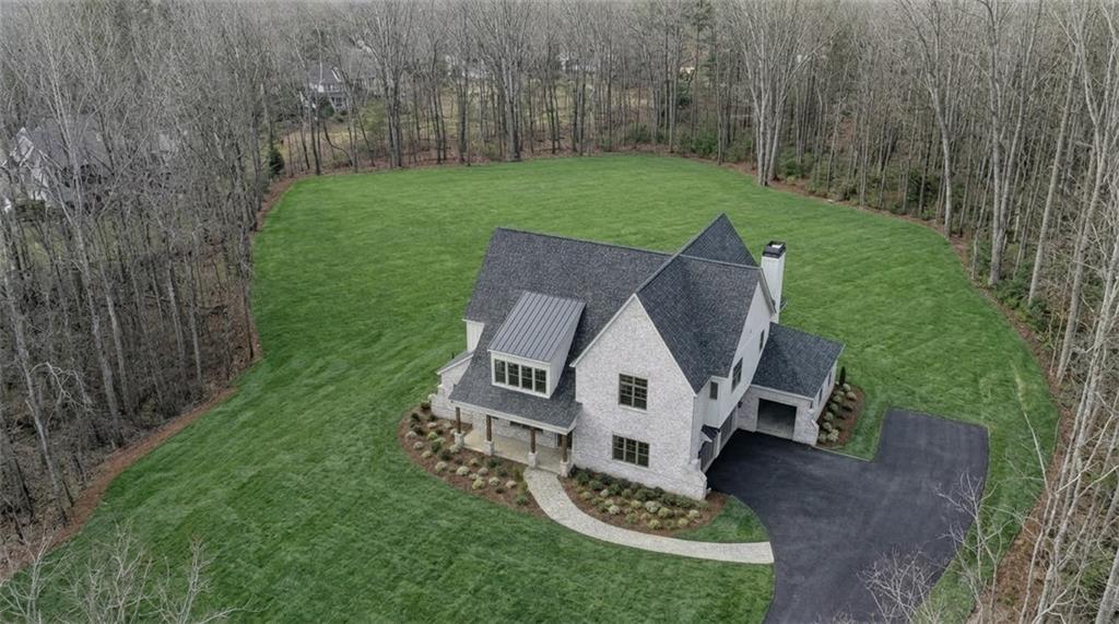 879 Arnold Mill Road Woodstock, GA 30188 - Photo 3 of 9 a view of a garden with wooden fence