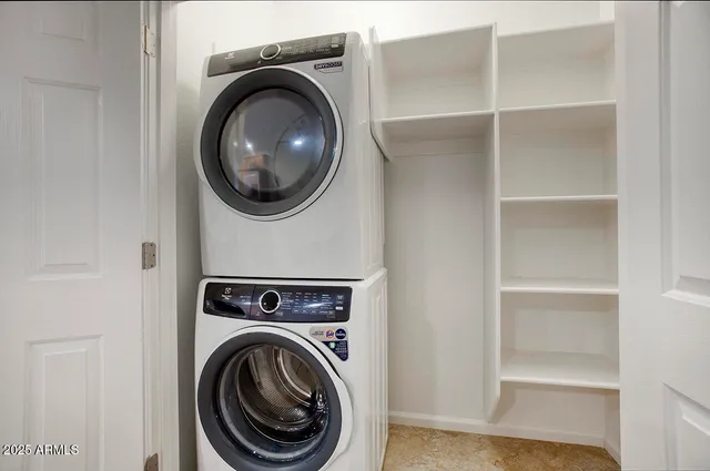 a view of a hallway with washer and dryer