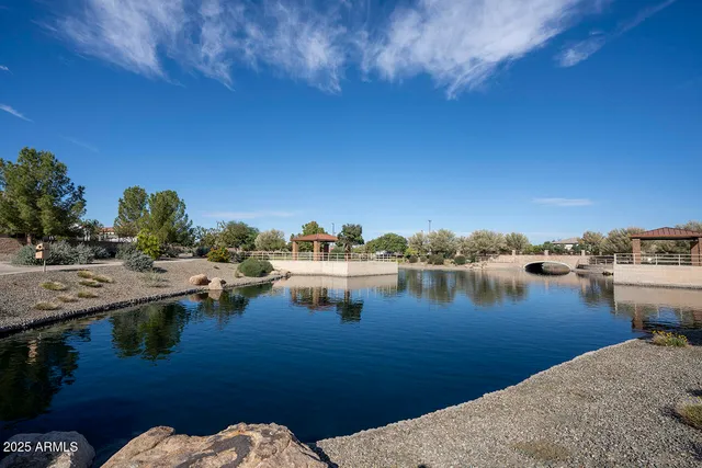 a view of a lake with sitting area