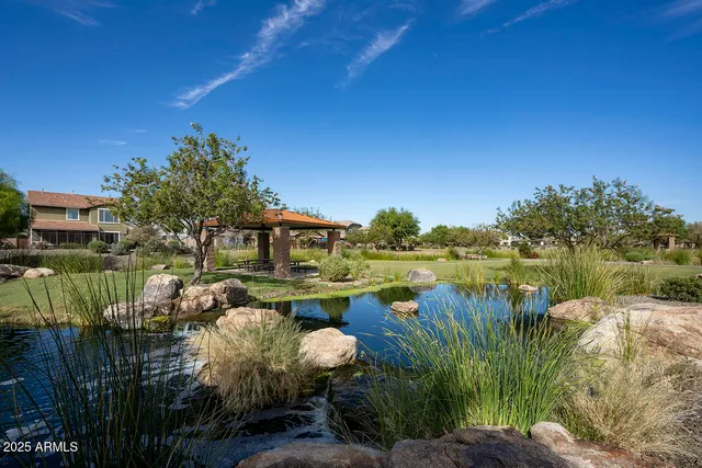 a view of a lake with a house in the background