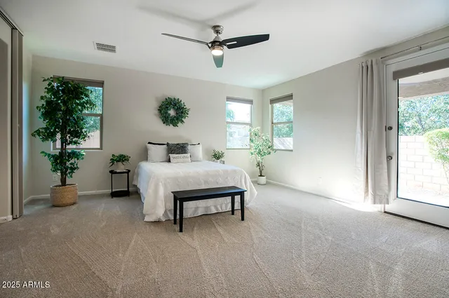 a bed room with a bed and a window