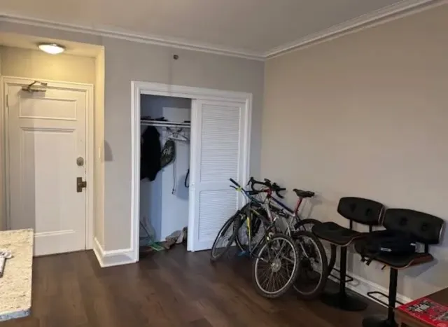 a view of a workspace with furniture and wooden floor