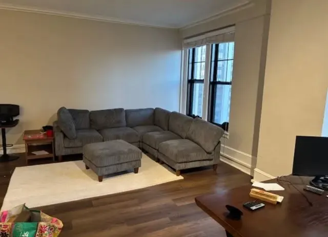 a living room with furniture and a window