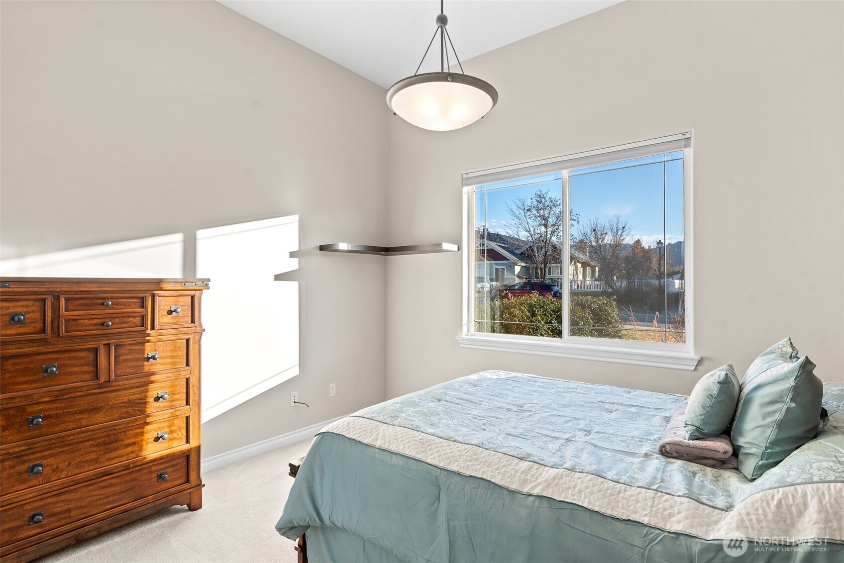 105 Cascade Place Cashmere, WA 98815 - Photo 24 of 39 a bed sitting in a bedroom next to a window