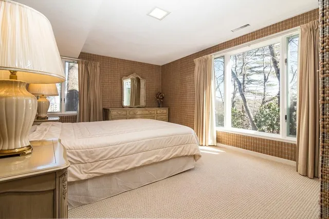 a bathroom with a shower sink vanity and mirror