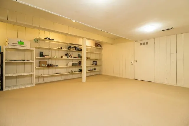 a view of entryway with a bathtub