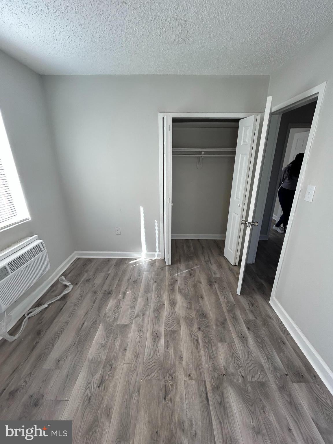 4715 1st Street Southwest, Unit 302 Washington, DC 20032 - Photo 9 of 9 an empty room with wooden floor and closet