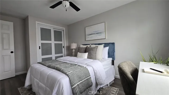 a bedroom with bed and window